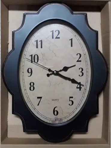 RELOJ DE PARED OVALADO TIPO MADERA 41X31CM