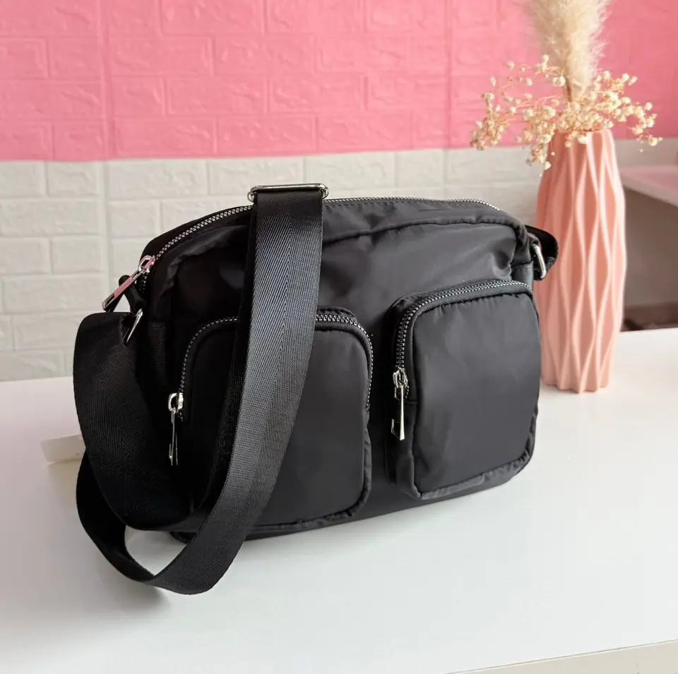 Bandolera impermeable con bolsillos