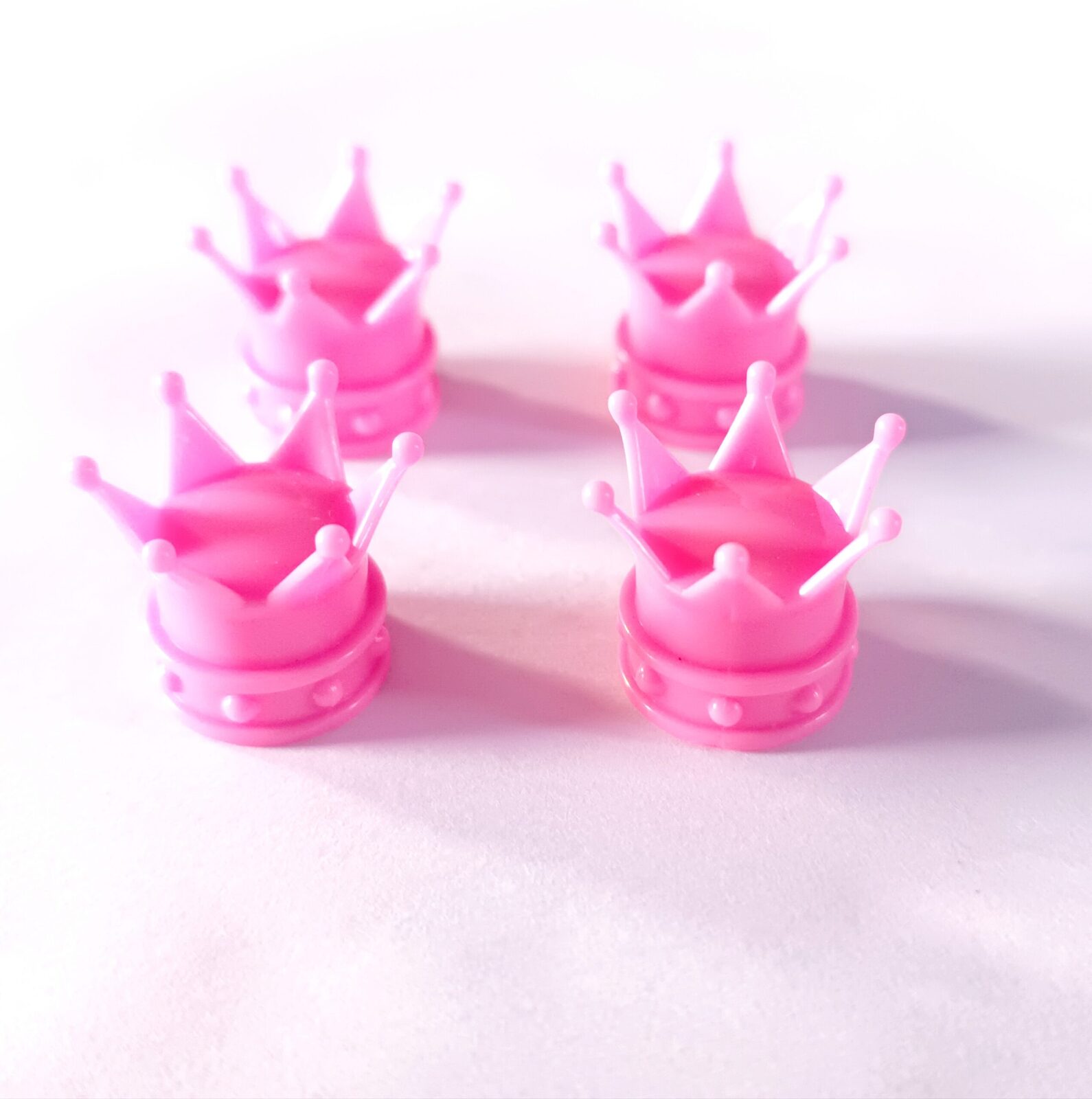 Juego Tapas de Válvula Corona Rosado