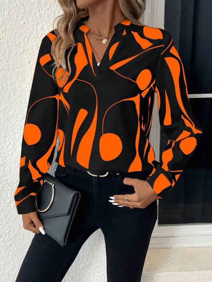 Blusa negra lineas y puntos anaranjados