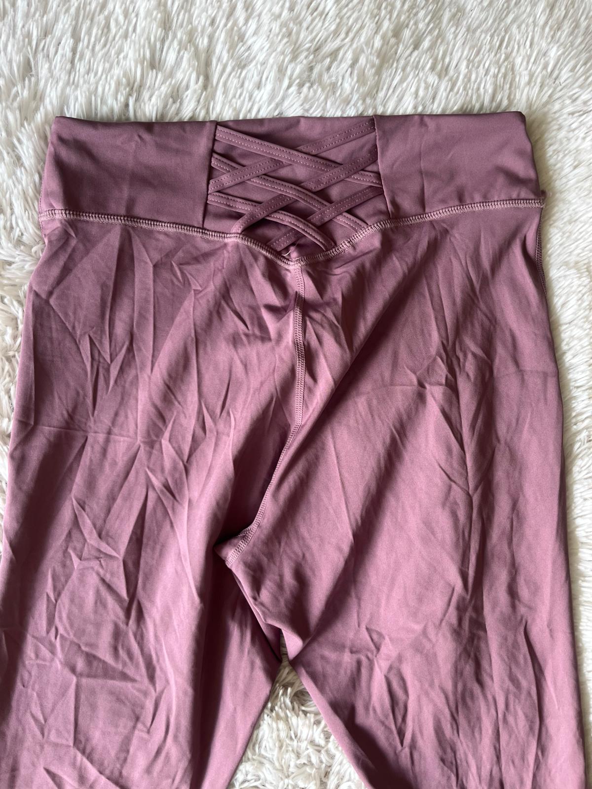 Calza deportiva rosa apagado cruzada atras