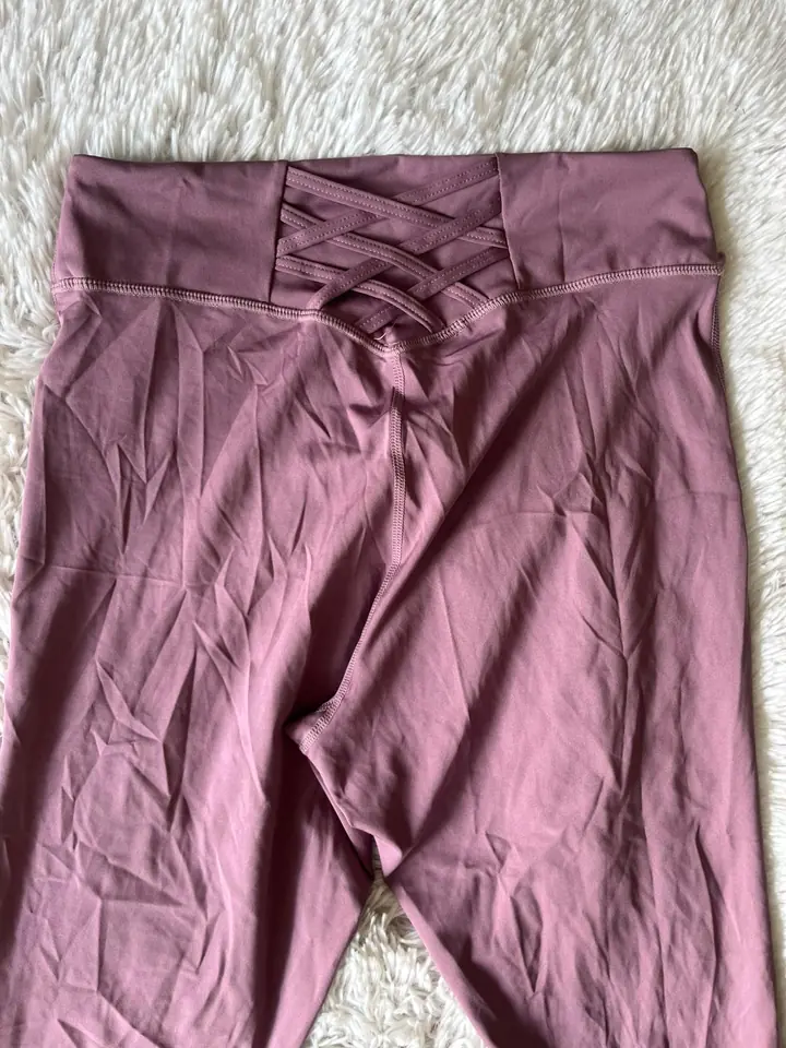 Calza deportiva rosa apagado cruzada atras