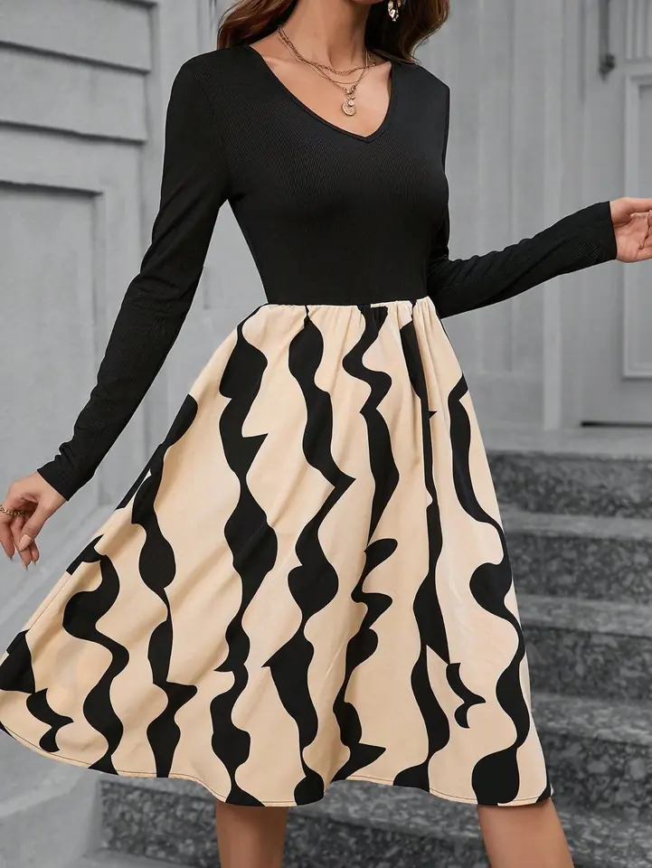 Vestido manga larga negro con falda rayada crema