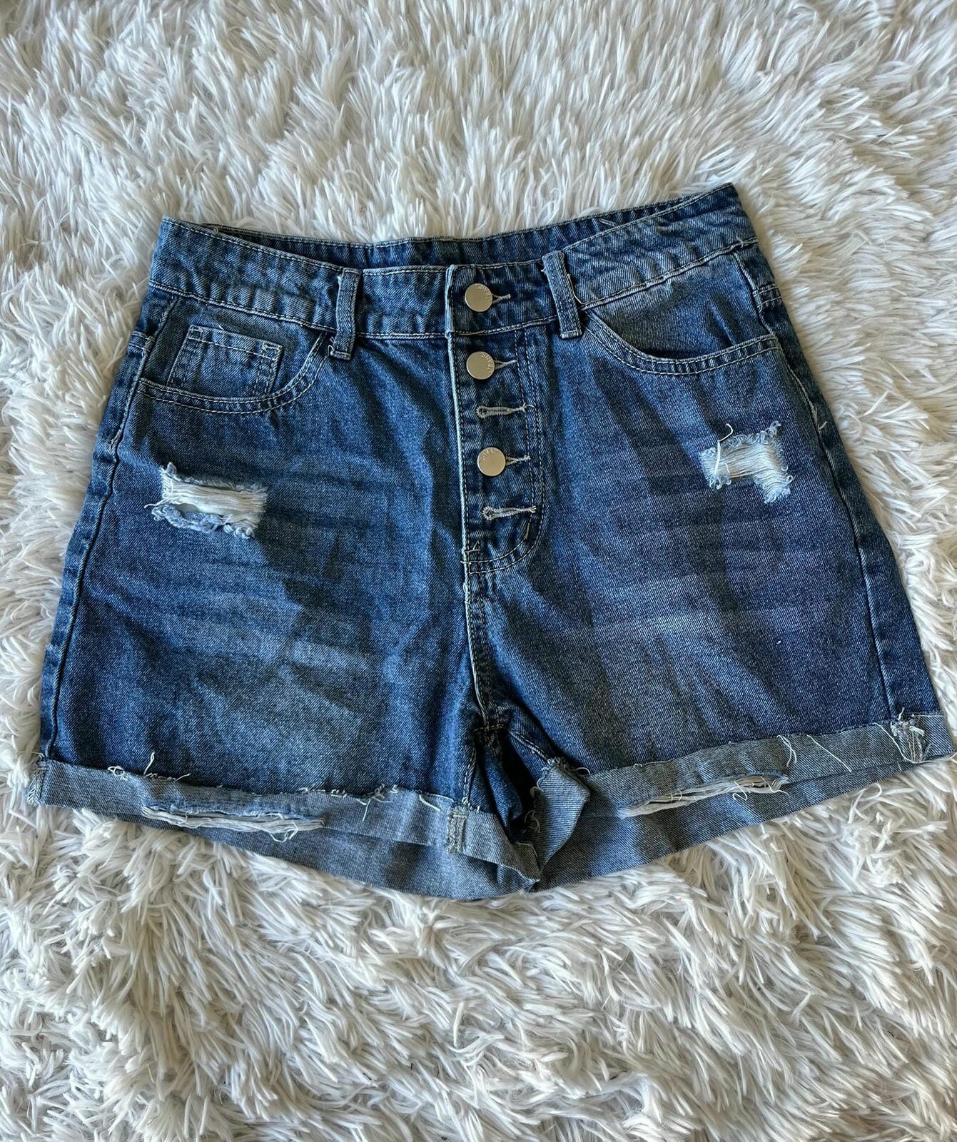 Short azul varios botones