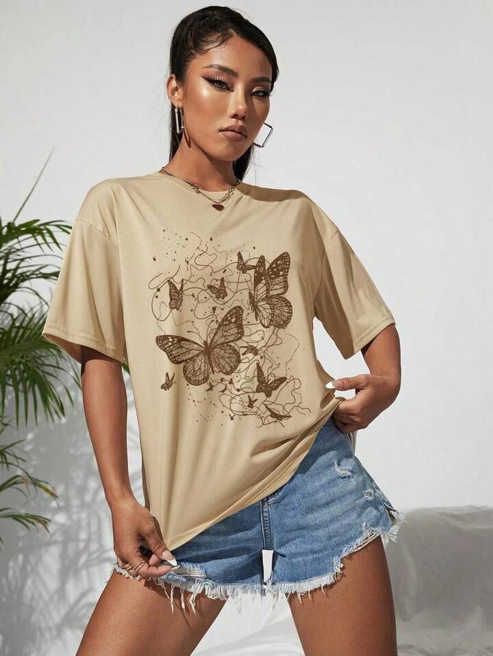 Remera beige mariposas marrónes