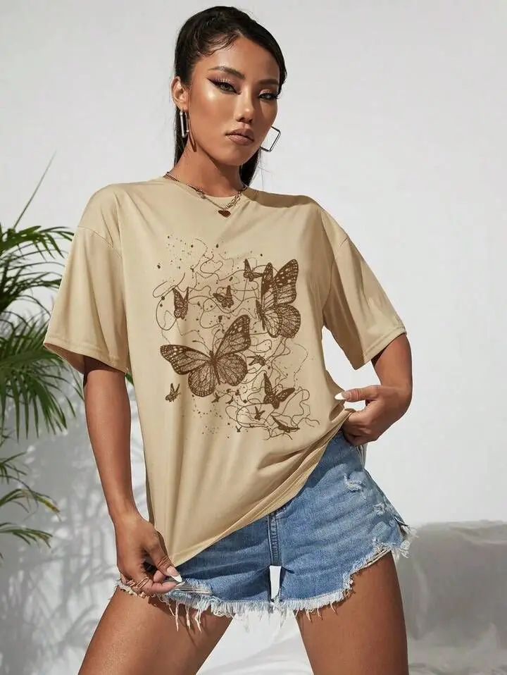 Remera beige mariposas marrónes